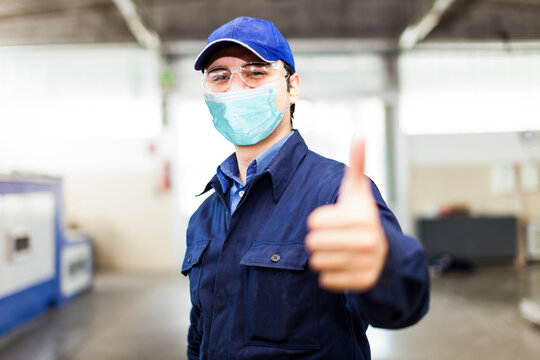 Thumbs Up, Covid Coronavirus Mask In Industrial Facility