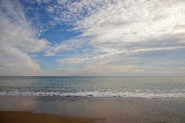 calming beach scene and cloudy sky