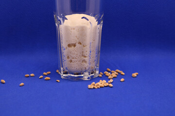 Wheat natural leaven for bread in a glass jar. The concept of a healthy diet. Sourdough starter. A living product. Grains. Selective focus.