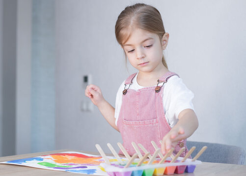 Little girl painting with ice paints. Homemade colours, Diy, activities for toddler.