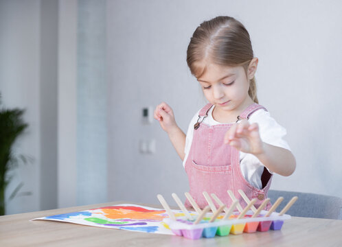 Little girl painting with ice paints. Homemade colours, Diy, activities for toddler.