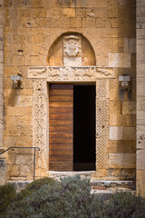 Lateral entrance to Sant'Antimo Abbey, Tuscany, Italy