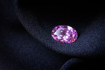 natural pink sapphire on black background