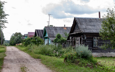 Fototapeta na wymiar Russia. A lifting dirt road in the village.