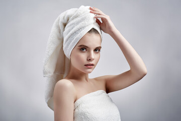 Beautiful girl in towel on white background