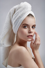 Beautiful girl in towel on white background