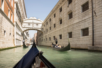  The gondolier floats on a gondola with tourists © Aleksandr