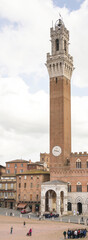 Fototapeta premium Tourists visiting the sights of the Piazza del Campo.Siena
