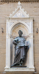 Fototapeta na wymiar Statue of St. Matteo, the sculptor Ghiberti. Church Or San Michele