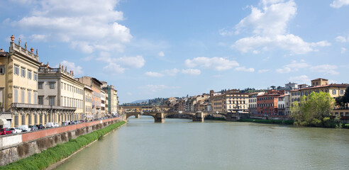 Fototapeta na wymiar View of the Arno river from the bridge. Florence