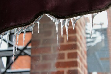 Icicles in Montreal, Canada, in North America during winter month of January on snowy weather....