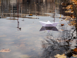 paper boat on the water 