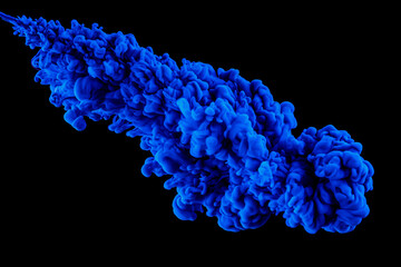 Abstract blue ink in water on a black background.