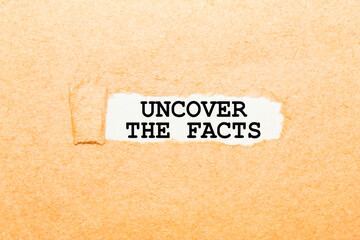 Fototapeta na wymiar text UNCOVER THE FACTS on a torn piece of paper, business concept