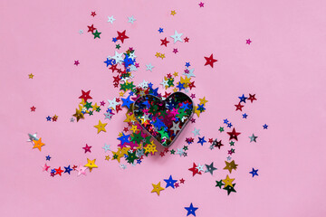 multicolored confetti on pink background, greeting card template