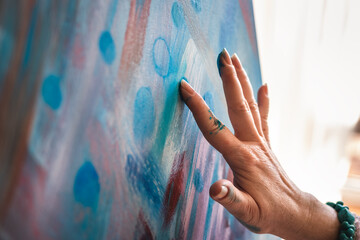 Painting on canvas using just hands and fingers. Abstract art paintings