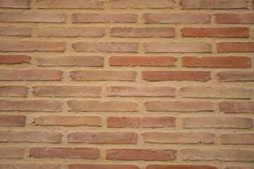 Red cement brick wall texture with natural lighting