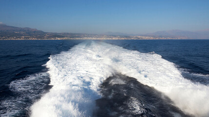 Trace from a catamaran.Rethymno. Island of Crete