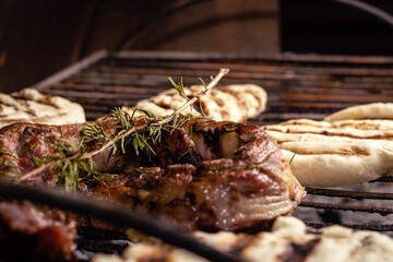 grilled meat with roasted fire rosemary and bread dough tortilla cordoba argentina
