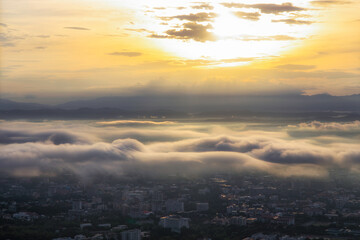 Beautiful sunshine at misty morning mountains