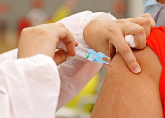 syringe prepared for vaccination