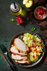 Healthly food. Baked meat steak salad and Chinese cabbage salad with apple, pomegranate, walnuts and on a stone tabletop. Top view flat lay. Copy space.
