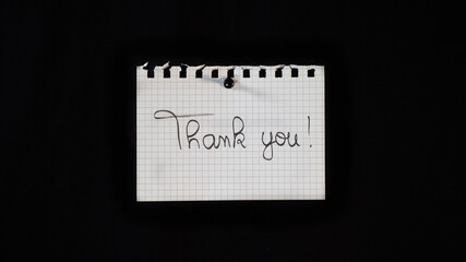 Hand written message on a ripped notebook sheet, 
