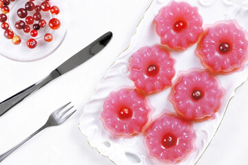Berry pudding on a white background.Fruit jelly. Flat lay. Pudding of cranberries. Vegan food. Healthy food