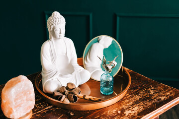 Composition with buddha on wooden table. Zen concept