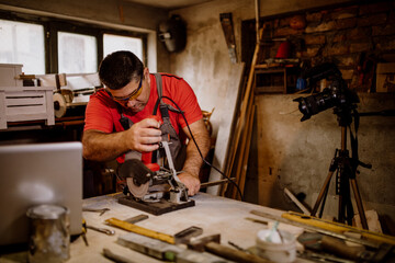 Craftsman cutting metal and using angle grinder