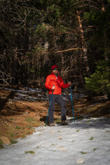 young man hiking on a snowy mountain