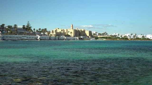 The ancient fortress Ribat stands on the shores of Monastir, Tunis. Fortress for protection against pirates. Old elite bricks. Fortress in the distance
