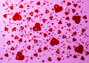 Flat view of valentines hearts on pink background. Symbol of love and Saint Valentine's Day concept.