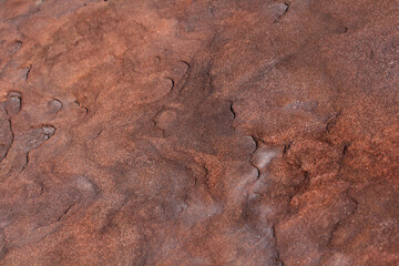 Metallic rusted plates in orange and brown