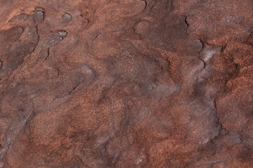 Metallic rusted plates in orange and brown