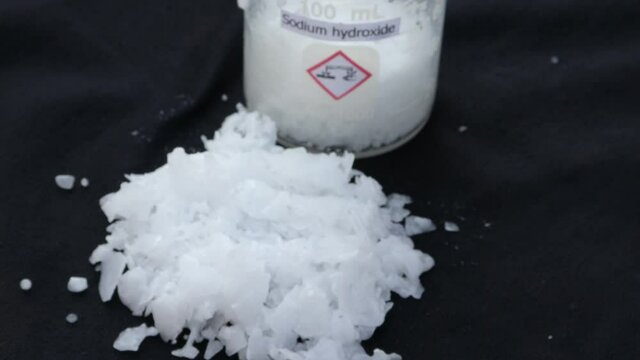 caustic soda flake on black background