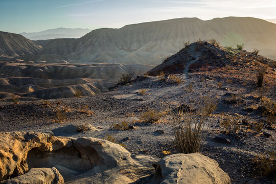 Caves and trails in the desert of Anza Borrego state park in southern California during a winter sunset. 