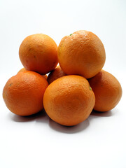Piled oranges, isolated on a white background 