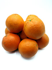Piled oranges, isolated on a white background 