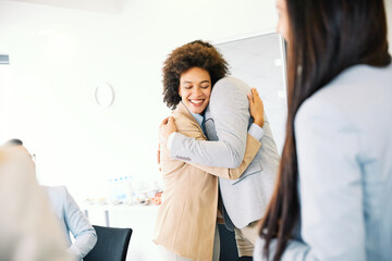 hug hugging coworker love partner office business happy relationship