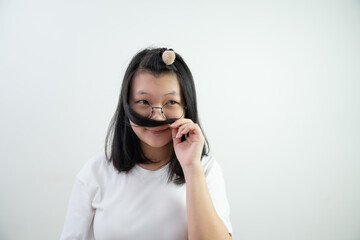 Fototapeta premium Asian glasses young woman is Thinking something and smelling her hair on on white background.