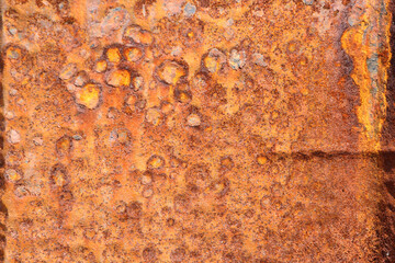 Metallic rusted plates in orange and brown