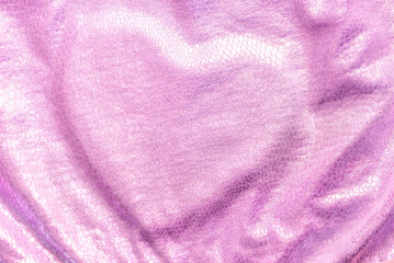 Fototapeta na wymiar Wrinkled lilac fabric with heart