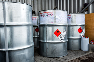 Big metal barrels containing hazardous chemicals from laboratories, business and industry...