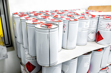 Metal tin containers for storing chemicals, chemistry background, industry waste management