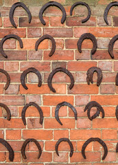 Horseshoes on wall, horseshoe background, UK