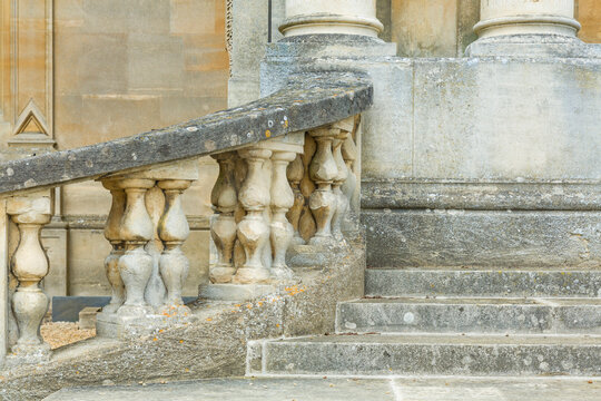 Stone steps and columns outside a manor house, UK
