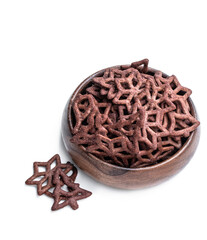 Christmas tree shapes pretzel in wooden bowl isolated on white background