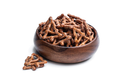 Christmas tree shapes pretzel in wooden bowl isolated on white background