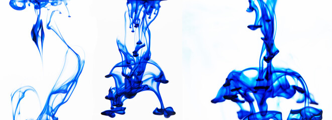 Blue ink in water on an isolated white background with copy space.